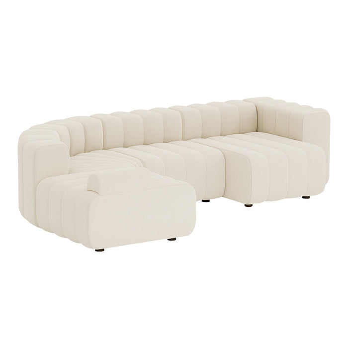 Cream-colored tufted sectional sofa with clean lines and a modern design. Perfect for contemporary interiors.