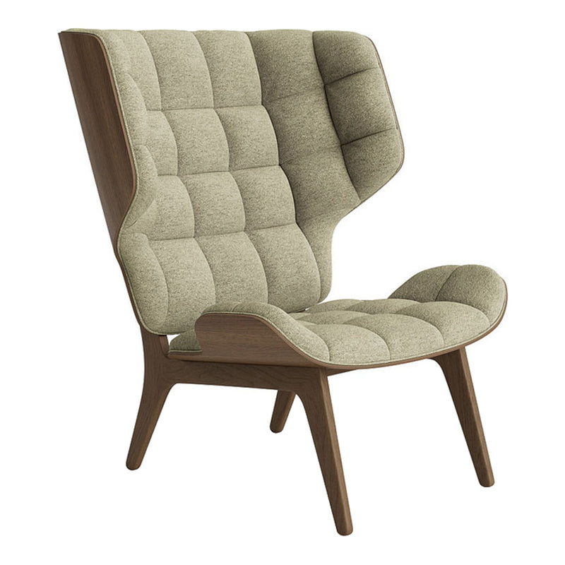Light green fabric armchair with tufted pattern and wooden legs, showcasing a modern, stylish design.