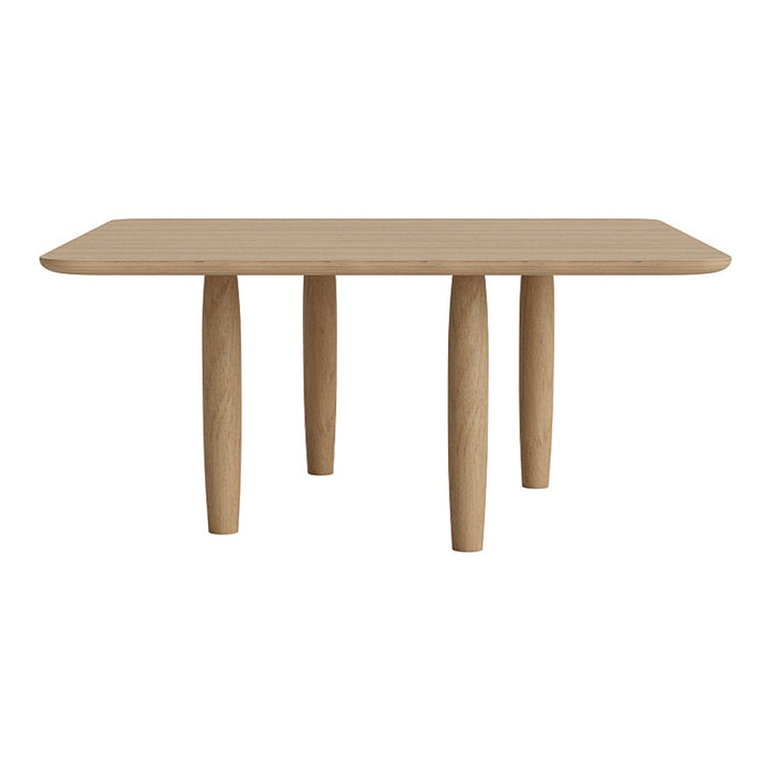 Light oak dining table with a smooth surface and rounded edges, featuring four sturdy cylindrical legs.