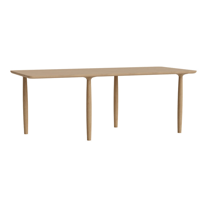 Light wood dining table with a smooth finish and simple, modern design. Ideal for contemporary interiors.