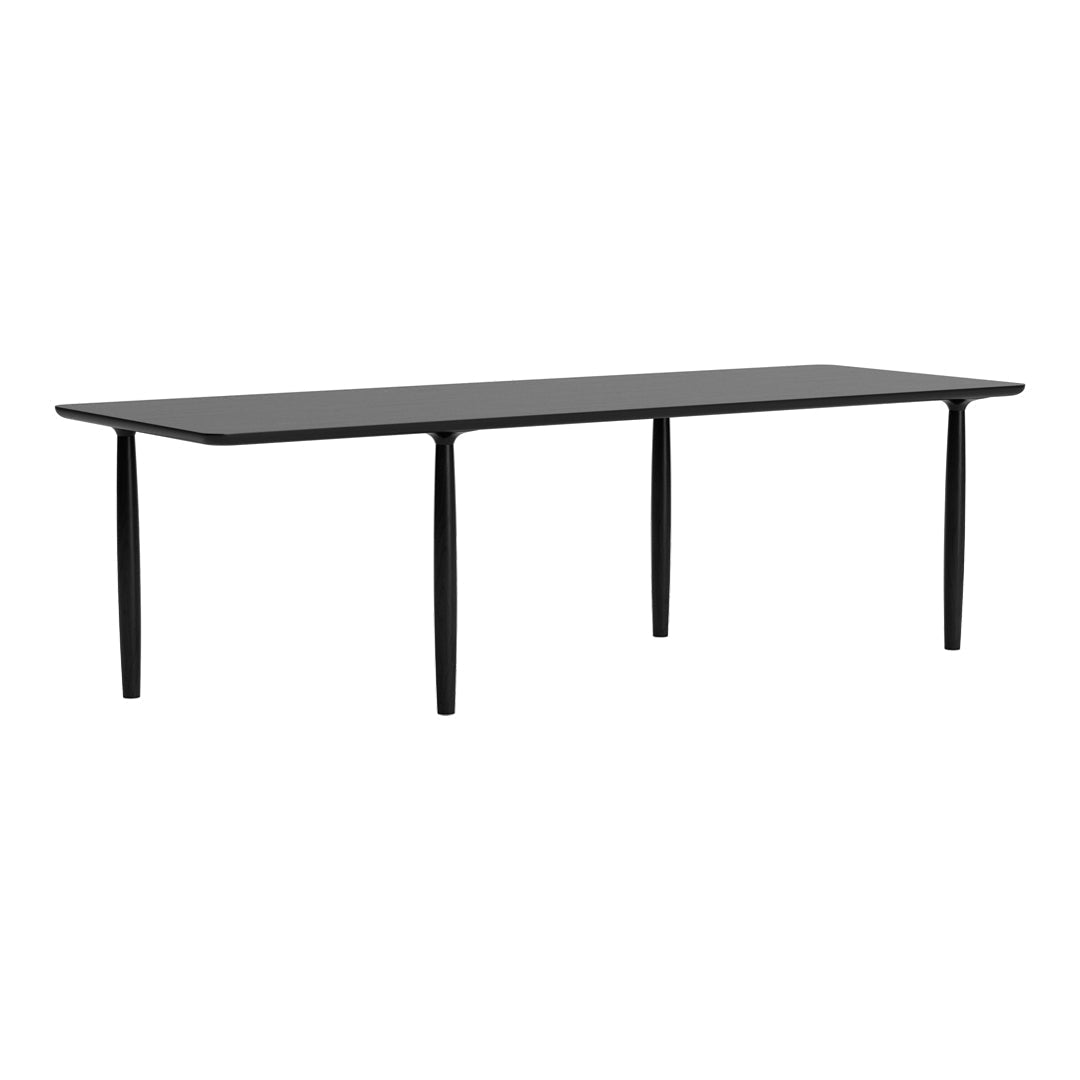 Sleek black rectangular table with smooth surface and minimalist design, featuring four slender legs.
