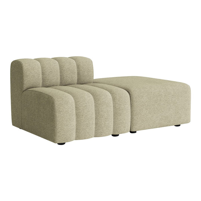 Beige modular sofa with ribbed texture and smooth surface, featuring a contemporary design and playful lines.