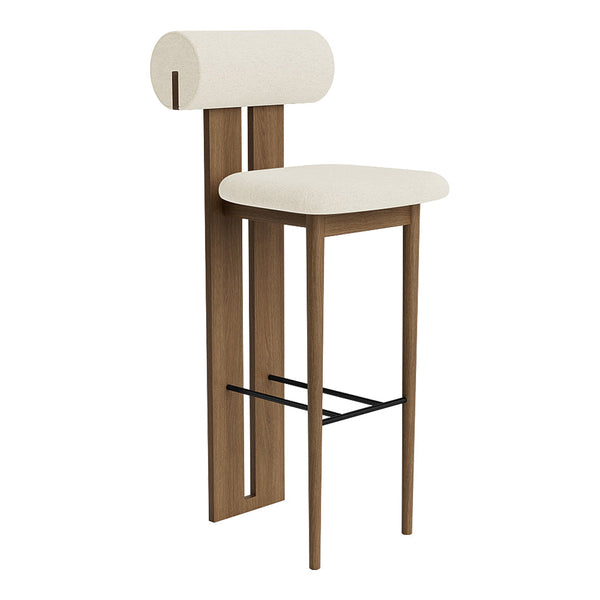 Beige upholstered bar stool with a unique rolled back design and light wood frame, accented by a black footrest.