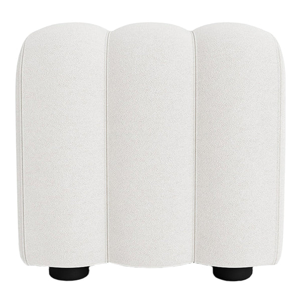 Cream-colored upholstery with a smooth texture, featuring a minimalist design and rounded silhouettes.