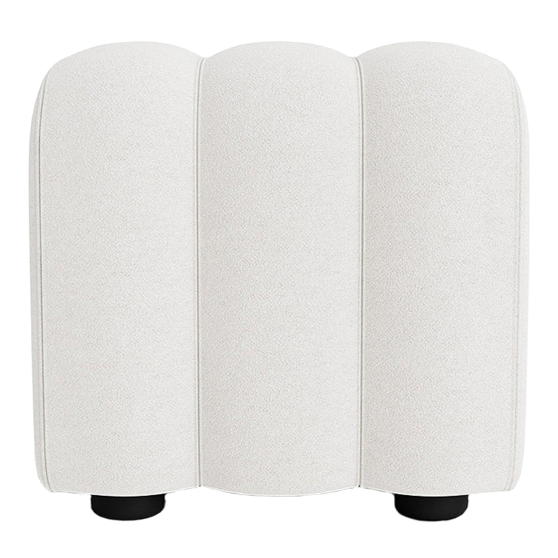 Cream-colored upholstery with a smooth texture, featuring a minimalist design and rounded silhouettes.