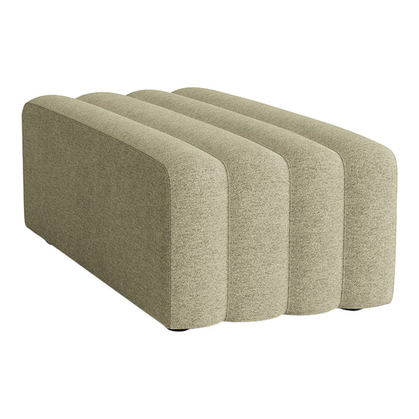 Beige upholstered furniture piece with soft, rounded edges and a textured surface, featuring a minimalist design.