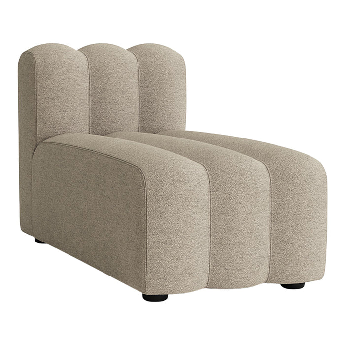 Beige upholstered chaise lounge with curved, modern lines and a soft, textured fabric. Perfect for stylish interiors.