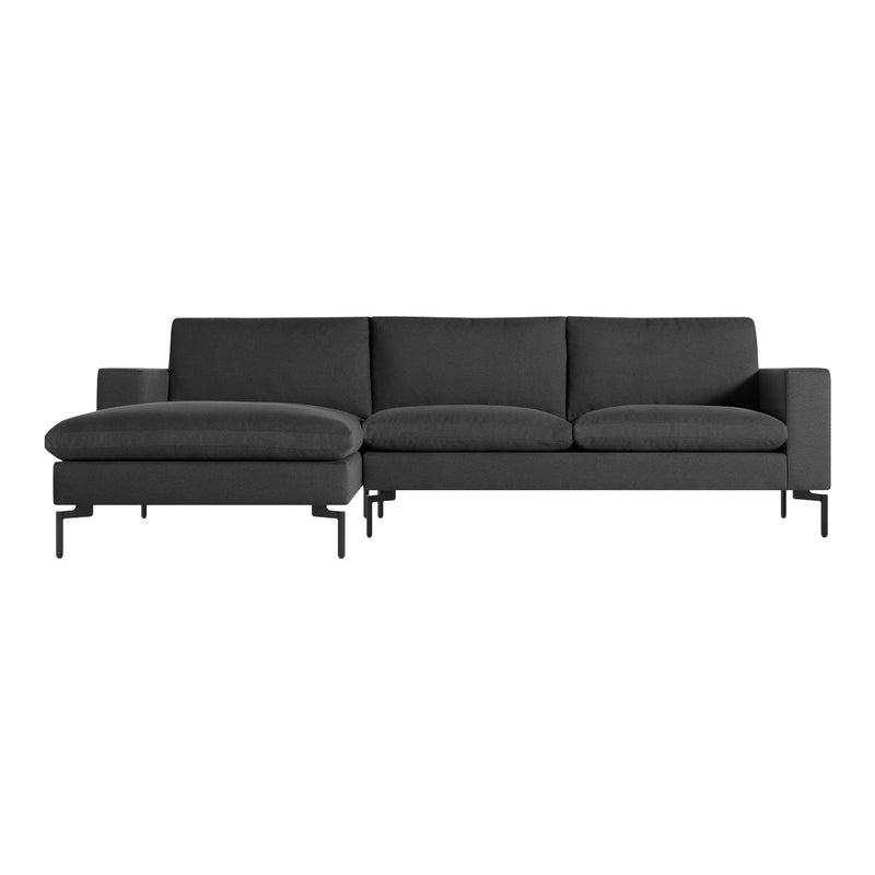 Modern dark gray sectional sofa with clean lines and minimalist metal legs, perfect for contemporary decor.