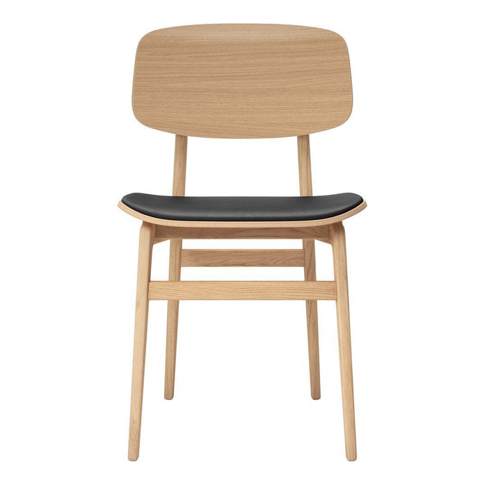 Natural wood chair with a smooth light oak finish and a sleek black padded seat. Modern minimalist design.