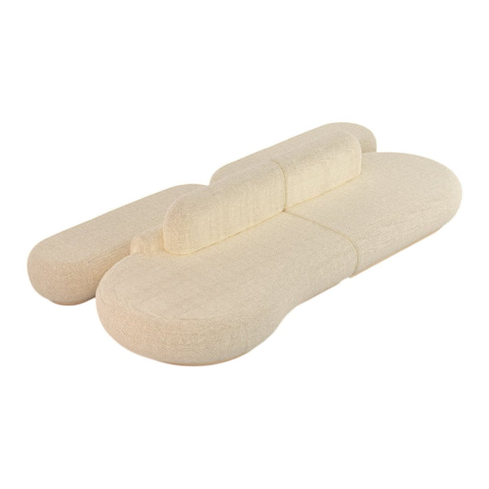 Cream-colored modern sofa with a unique, organic shape and subtle texture. Perfect for contemporary living spaces.