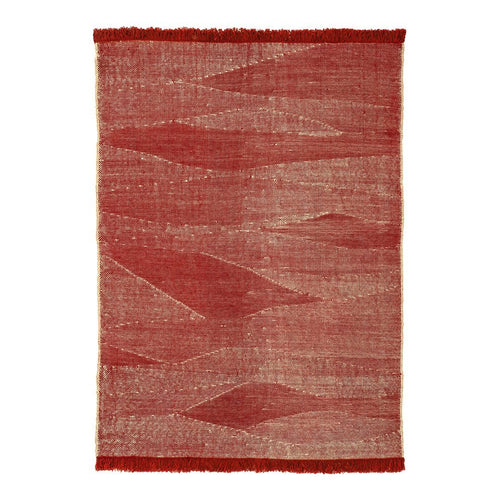 Red and beige patterned area rug with abstract wave designs and fringe edges. Ideal for cozy decor.