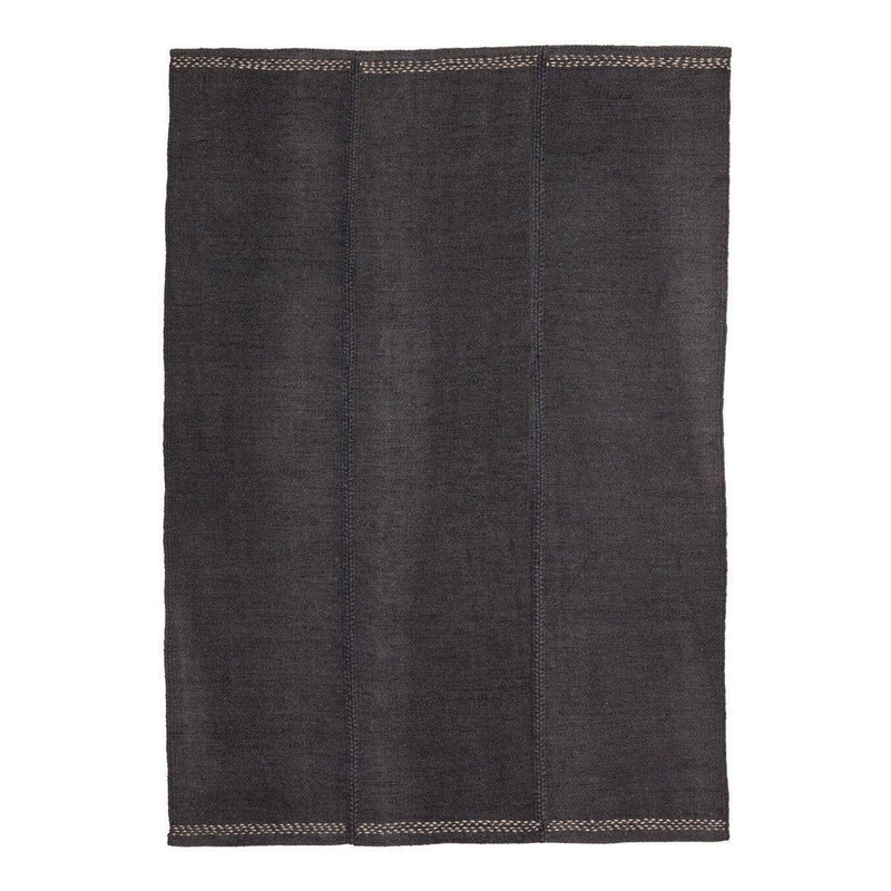 Dark gray textured rug with subtle contrasting stitching, featuring a simple, modern design. Perfect for versatile decor.