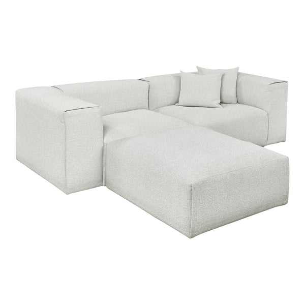 Modern sectional sofa in a soft, textured light grey color with matching accent pillows. Perfect for any living space.