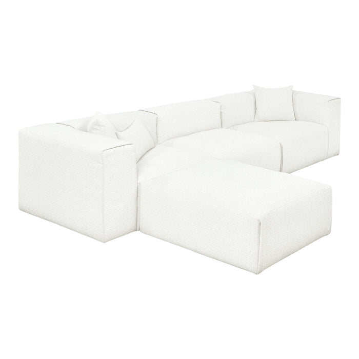 Textured white modular sofa with clean lines and minimalistic design, featuring matching white throw pillows.