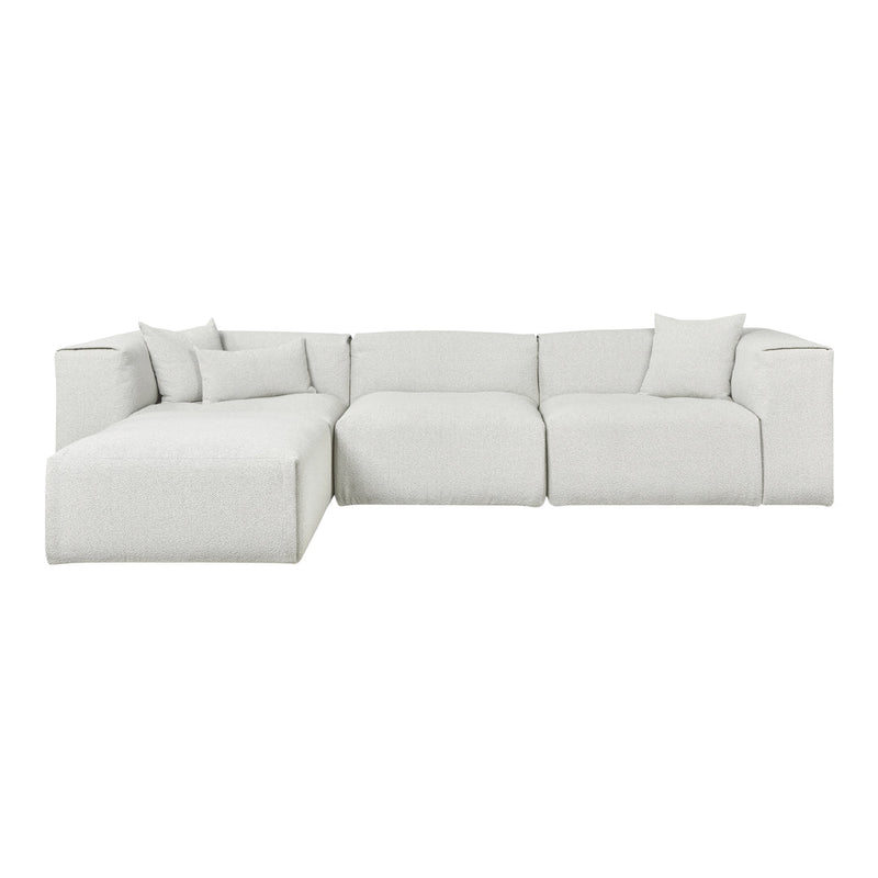 Light grey sectional sofa with a textured fabric and soft, plush pillows for a cozy look.