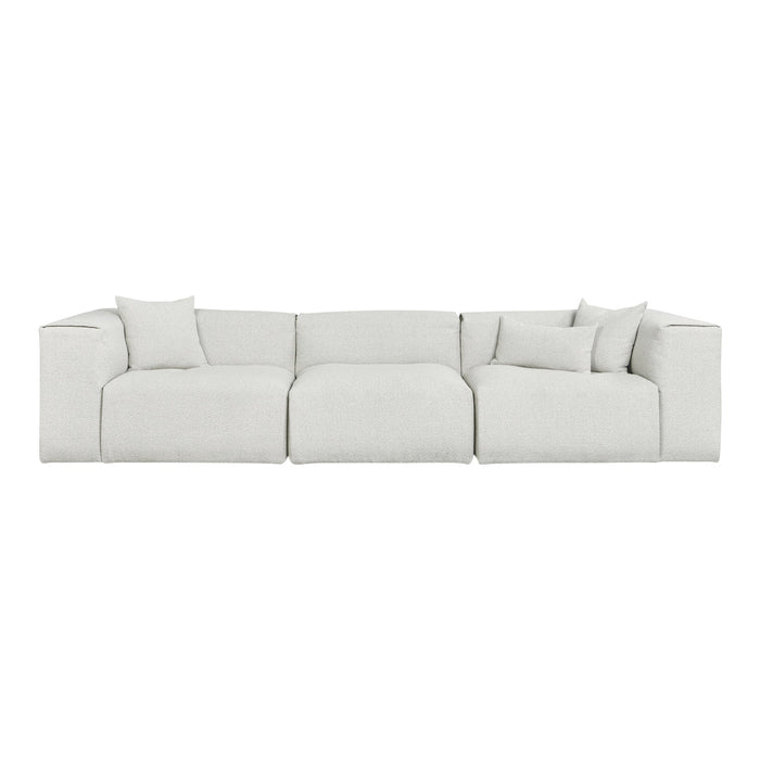 Light gray sectional sofa with textured fabric and matching throw pillows for a modern, minimalist look.