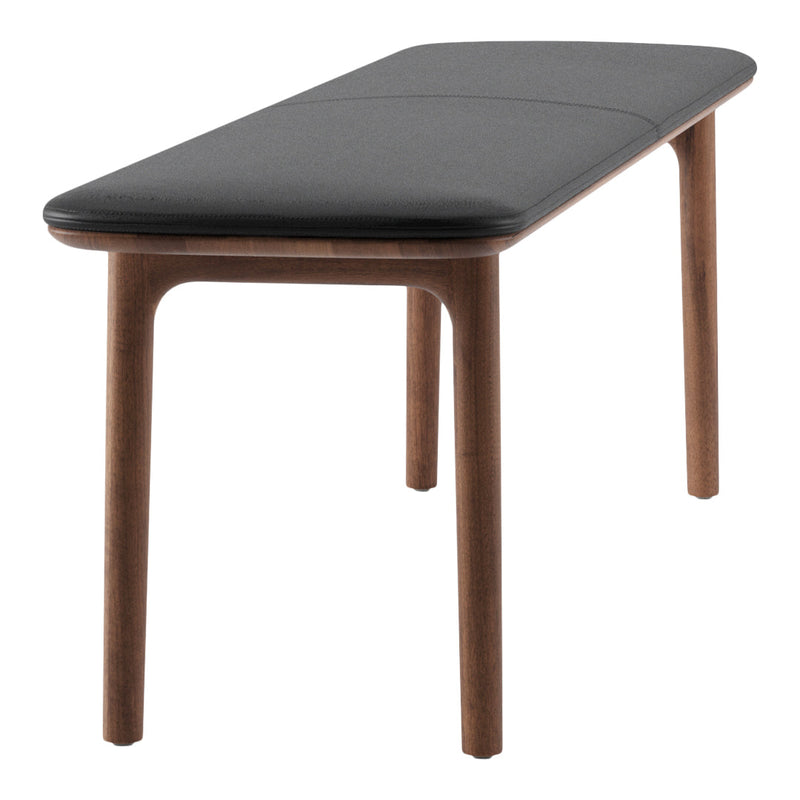 Black upholstered bench with a smooth surface and natural wood legs, showcasing a minimalist design.