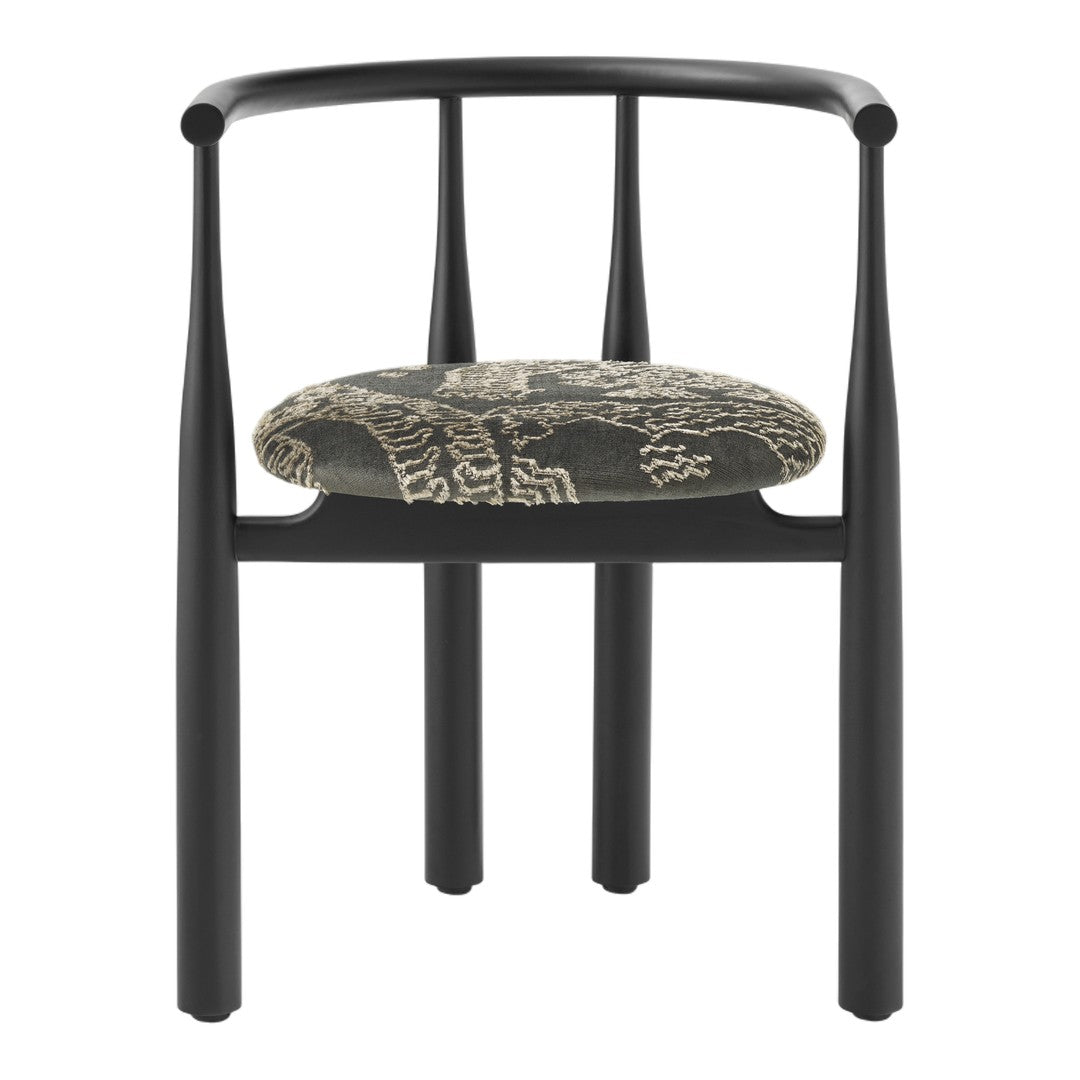 Black chair with a patterned cushion on a white background