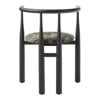 Black wooden chair with a patterned cushion on a white background