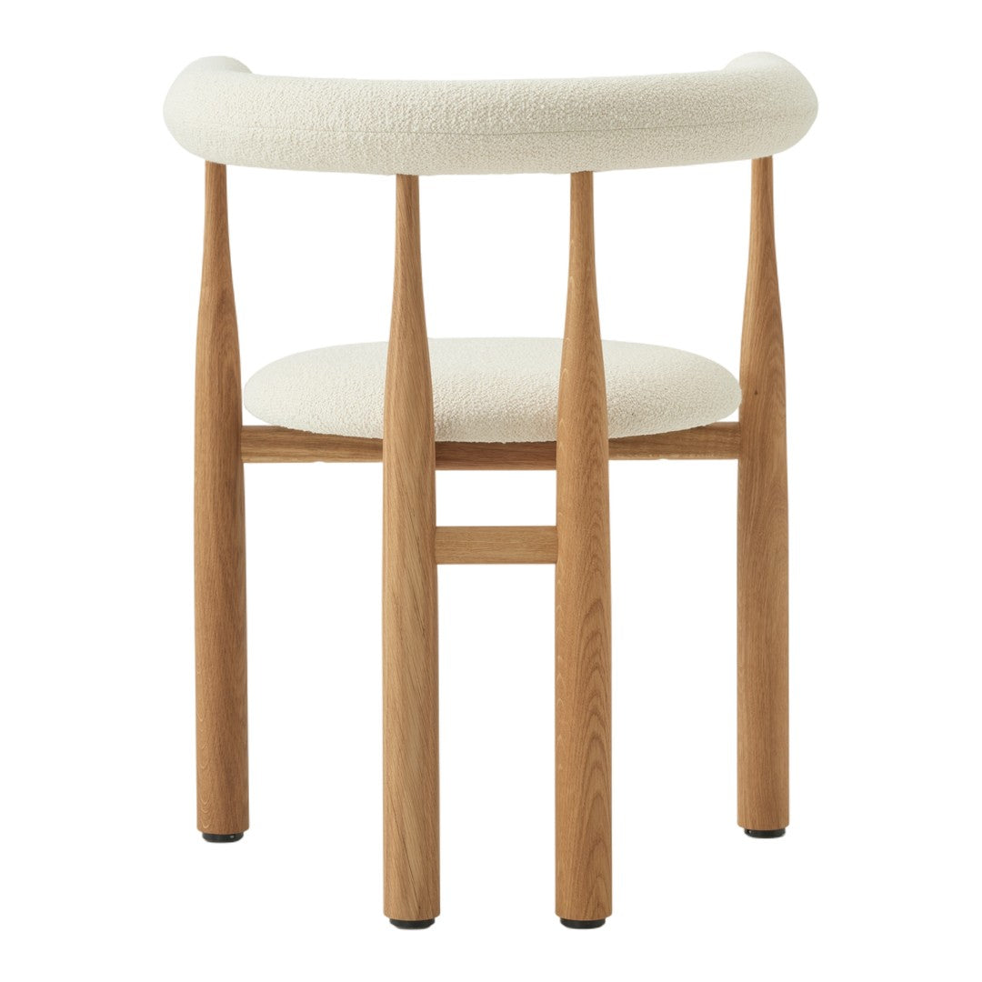 Chair with wooden legs and white cushioned seat and backrest on a white background