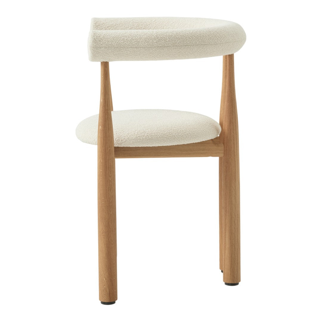 Stool with white cushioned seat and backrest on a white background