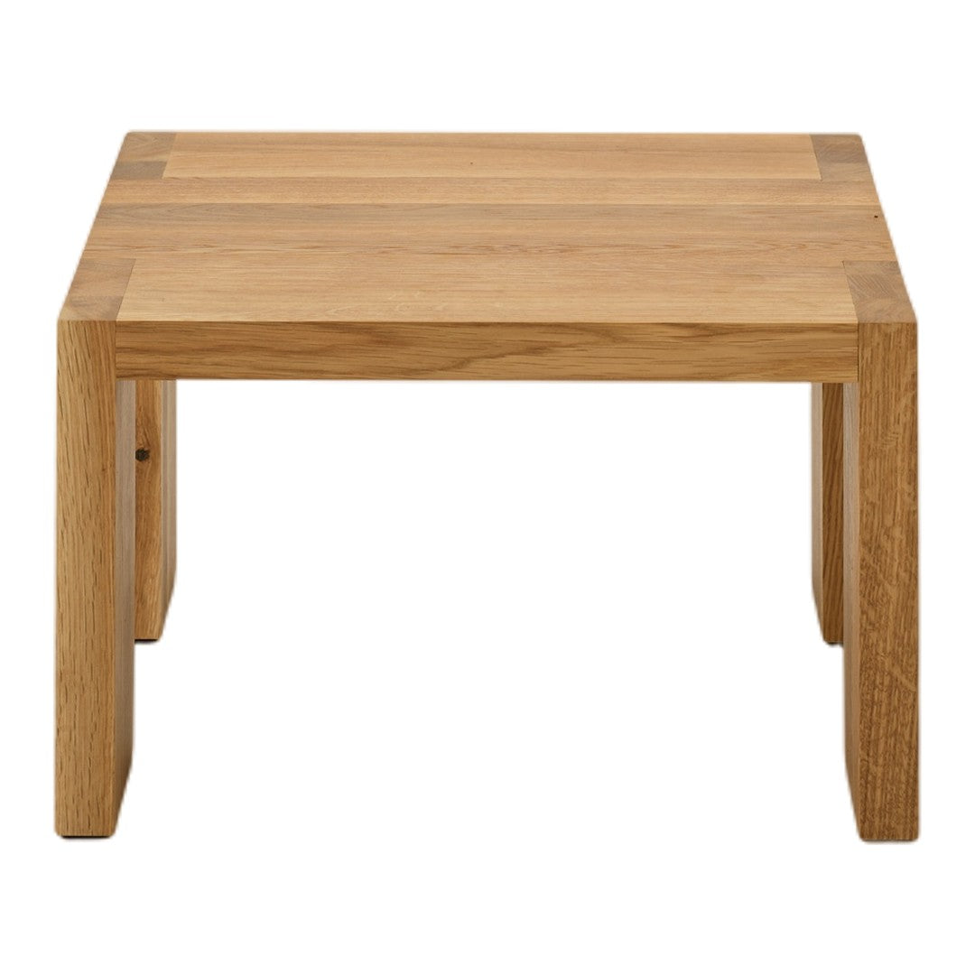 Natural oak coffee table with a light wood finish and simple, minimalist design featuring subtle grain patterns.