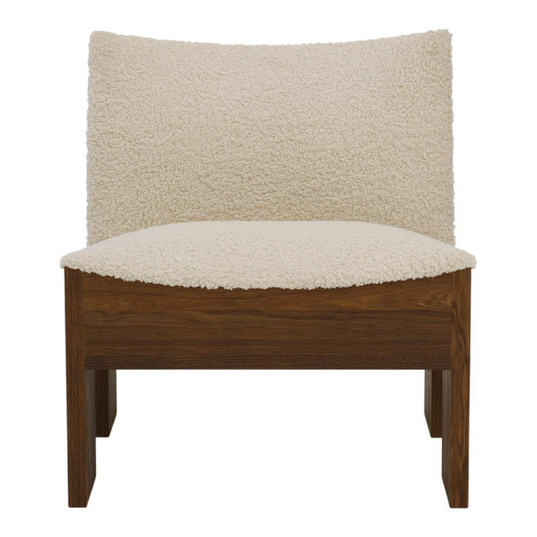 Cream-colored chair with plush, textured upholstery and rich brown wooden legs, showcasing a modern minimalist style.