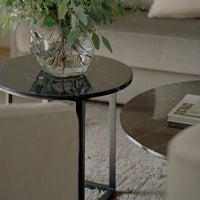 Stylish black marble coffee tables with sleek metal frames, featuring subtle veining patterns for a modern look.