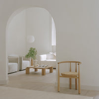 Soft neutral tones with light wood accents and subtle texture patterns, creating a calming, modern aesthetic.