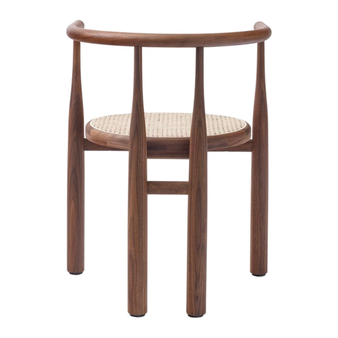Wooden chair with a rich walnut finish and a natural woven cane seat, featuring a minimalist design.