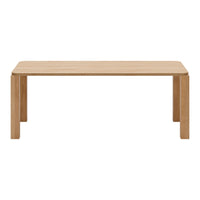 Light oak dining table with a smooth, natural wood grain pattern and minimalist design.