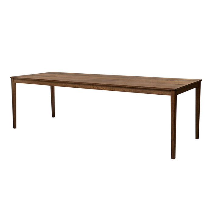 Solid wood dining table in warm walnut finish; minimalist design with smooth, natural grain pattern.