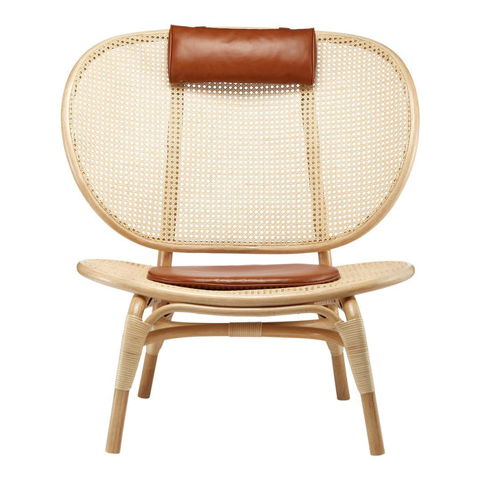 Natural rattan chair with woven cane pattern and brown leather accents. Stylish and modern design for any space.