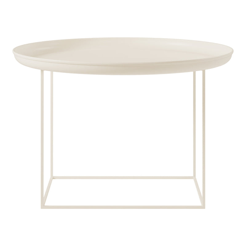 Round cream coffee table with a smooth surface and minimalist white metal frame. Stylish and modern design.