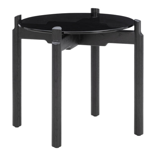 Round black glass table with sleek black wooden legs, featuring a minimalist design for modern decor.