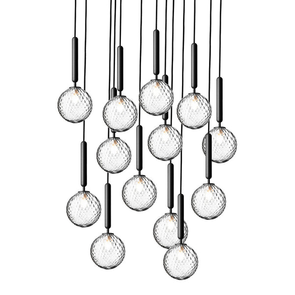 Cluster of hanging pendant lights with clear glass globes and sleek black accents, showcasing a modern geometric pattern.