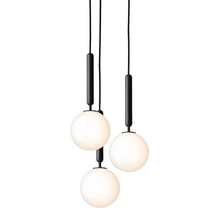 "Three pendant lights with black accents and frosted white glass globes, adding a modern touch to any space."