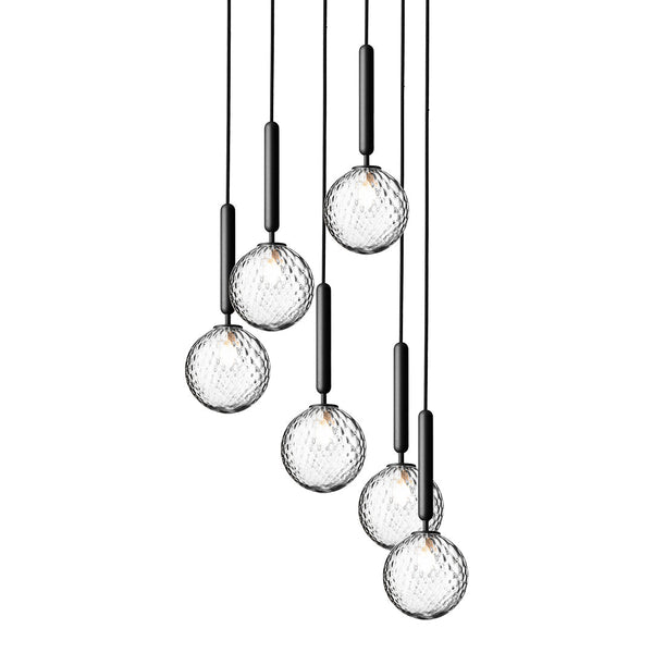 "Elegant pendant lights with clear glass globes and sleek black accents, featuring a textured geometric pattern."