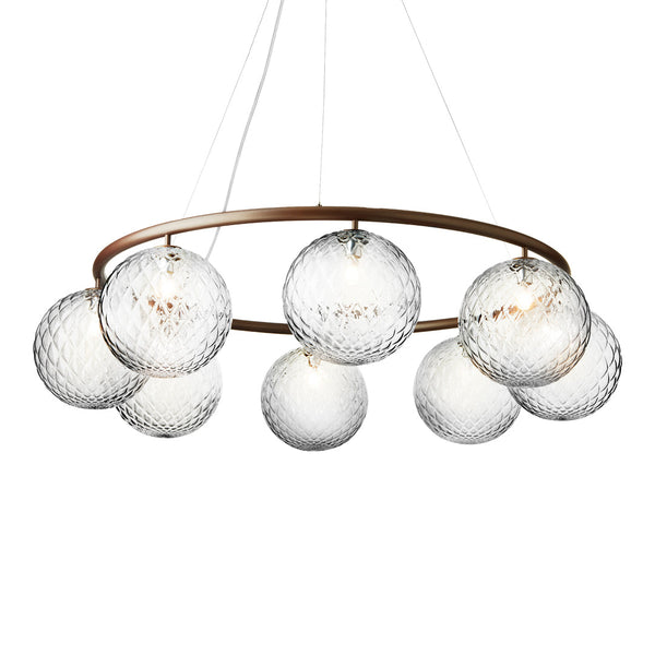 Modern chandelier with nine crystal globes and a gold metal ring, featuring a sleek, contemporary design.