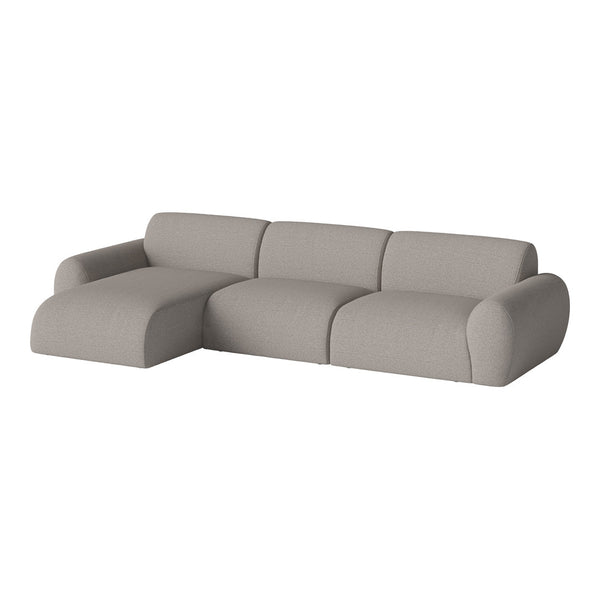 Light gray sectional sofa with smooth, textured fabric and modern rounded shapes. Ideal for contemporary living spaces.