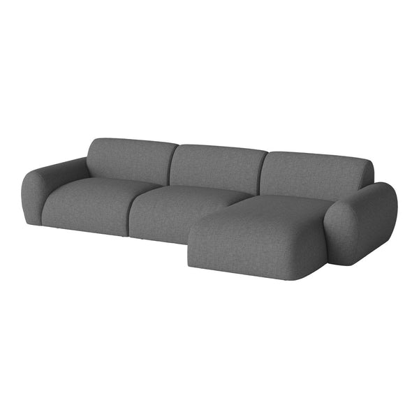 Gray upholstery with a smooth, textured finish; modern, curved design on a sectional sofa.