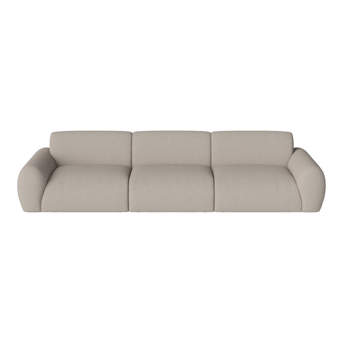 Beige upholstered sofa with soft, textured fabric and smooth, rounded edges in a modern design.