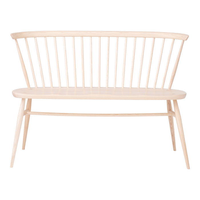Natural light wood bench with a minimalist design, featuring vertical slats and a smooth, pale wooden surface.
