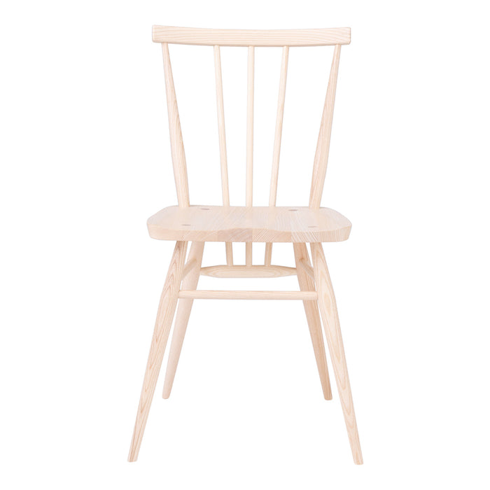 Light natural wood chair with a minimalist design, featuring subtle grain patterns and a neutral finish.