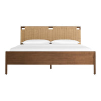 "Natural woven headboard with light brown wood frame, paired with crisp white bedding for a contemporary look."