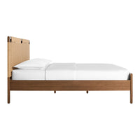 Wooden bed frame in rich brown with woven beige headboard and crisp white bedding. Minimalistic and modern design.