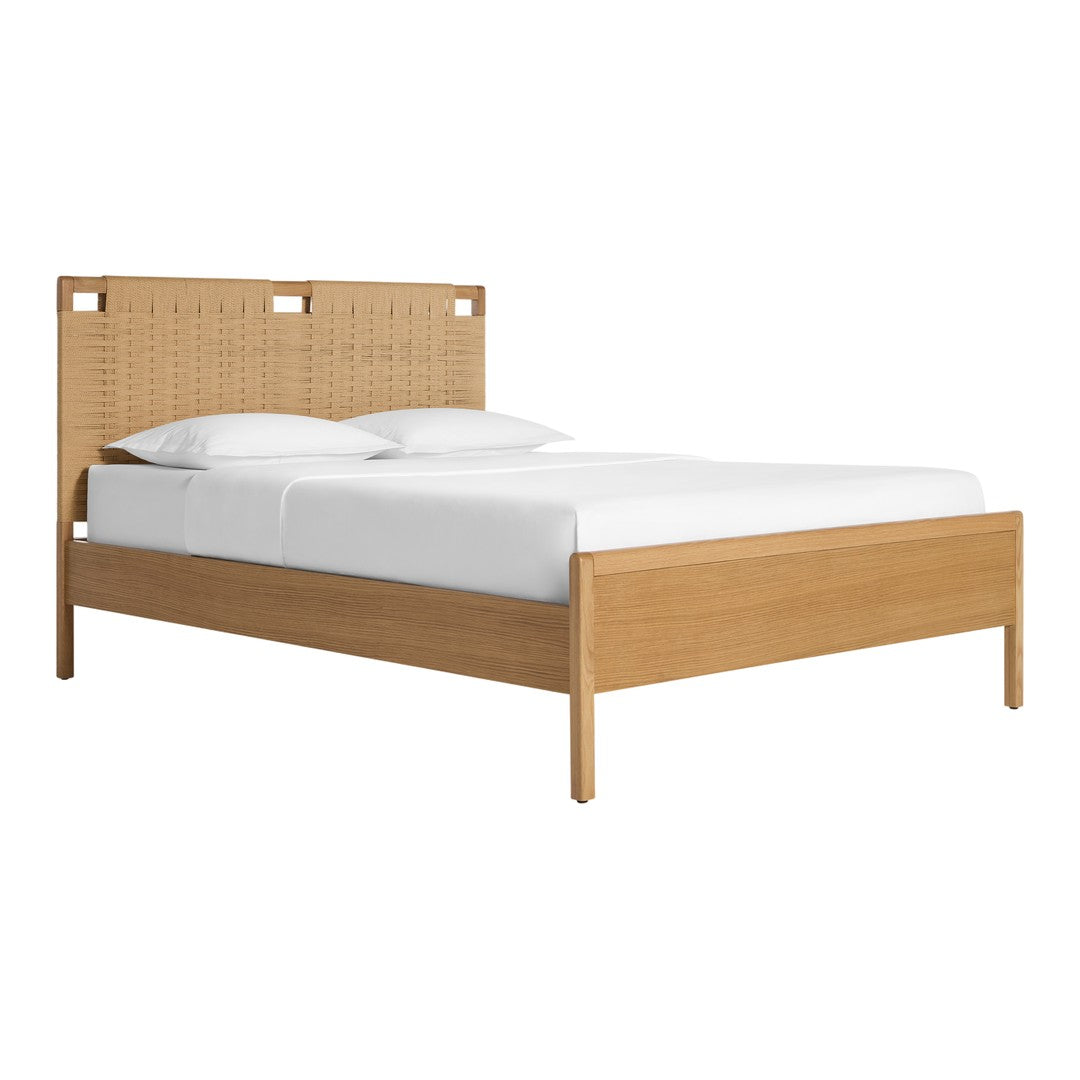 Natural wood tones with a woven rattan headboard, accented by crisp white bedding for a serene look.