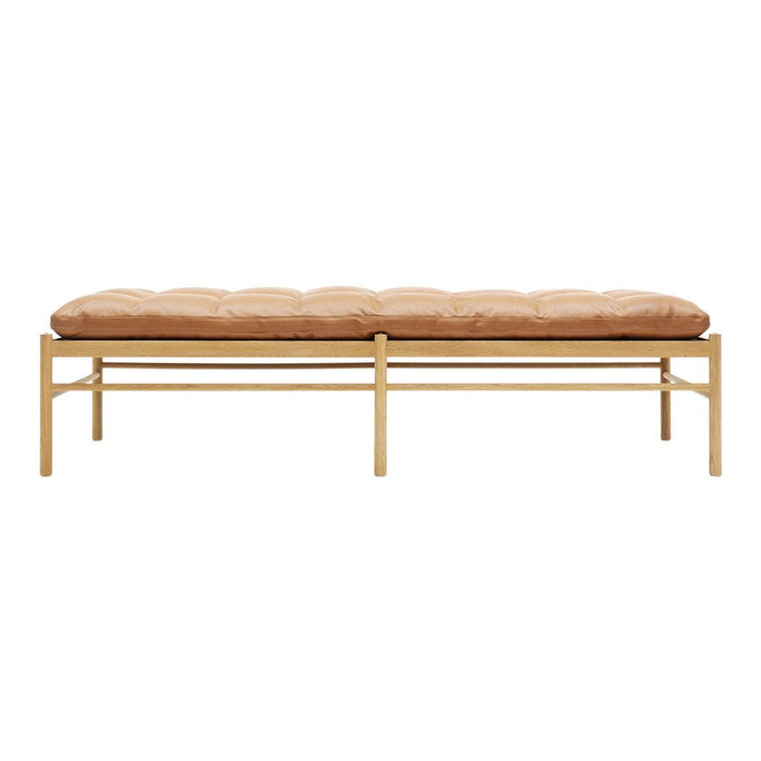 Beige tufted cushion on a sleek gold metal frame, offering a modern and minimalist aesthetic.