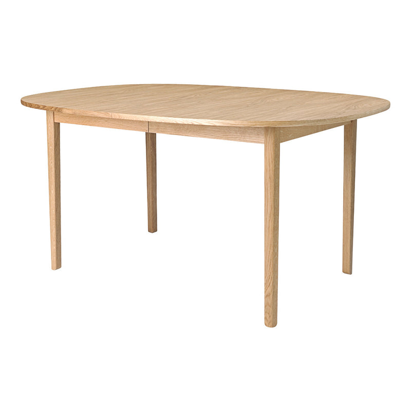 Natural wood dining table with a smooth, light finish and rounded edges, perfect for modern or rustic decor.
