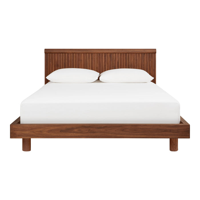 "Brown wooden bed frame with a slatted headboard and white mattress, featuring a minimalistic design."